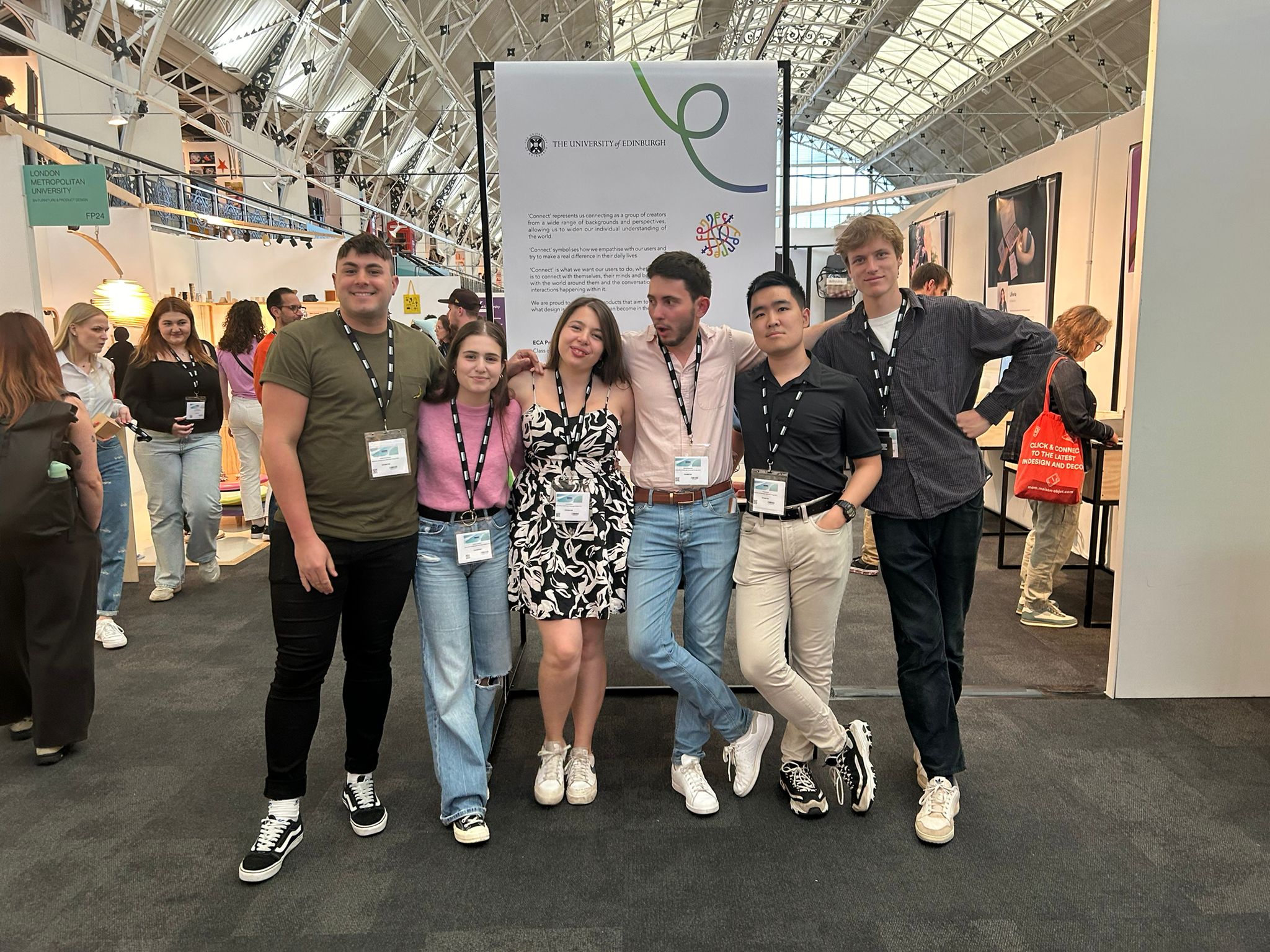 The Edinburgh group in front of the University of Edinburgh 'Connect' banner at New Designers