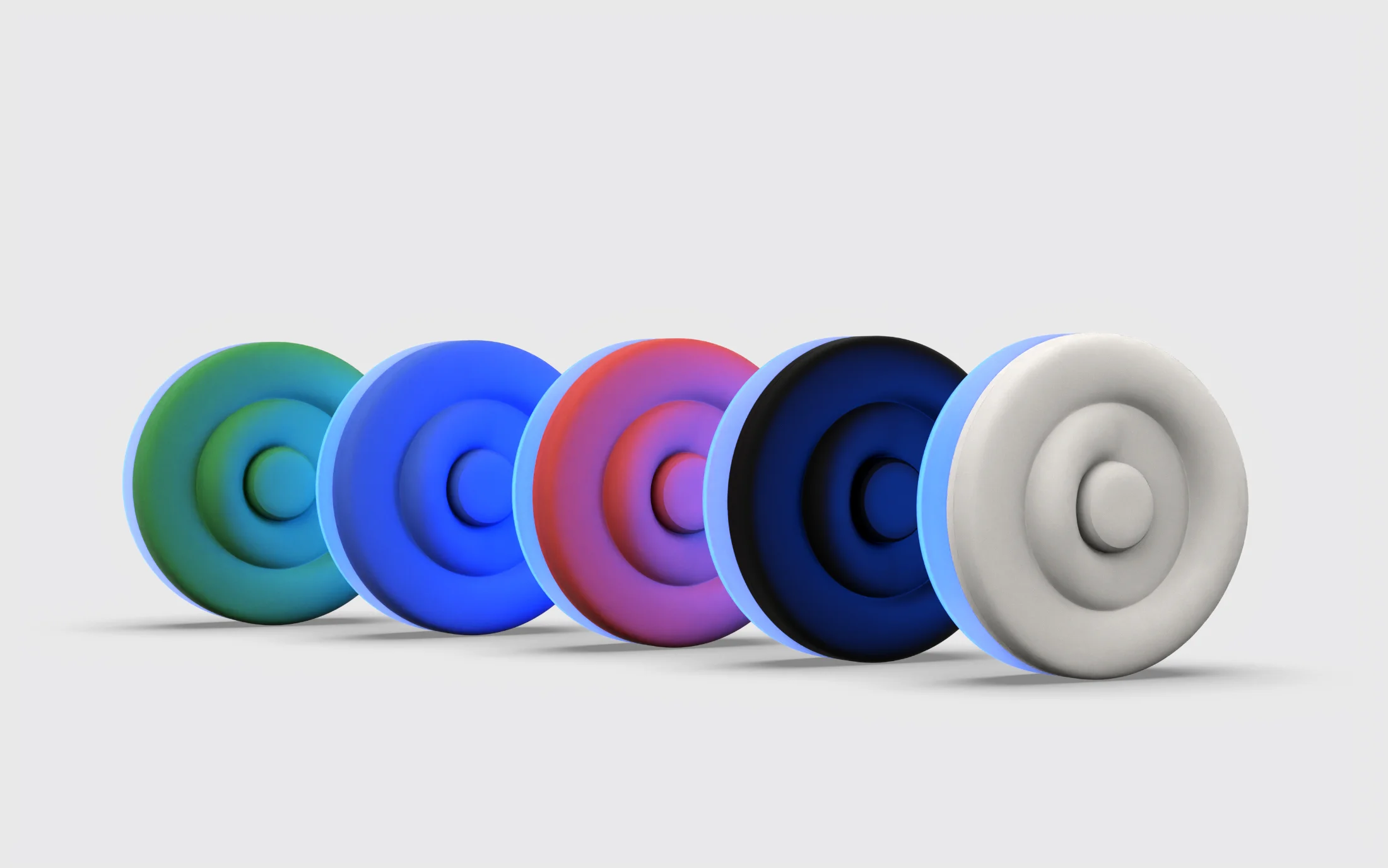 The five colour variants of the Onaka device lined up, green to white, each with a blue glow