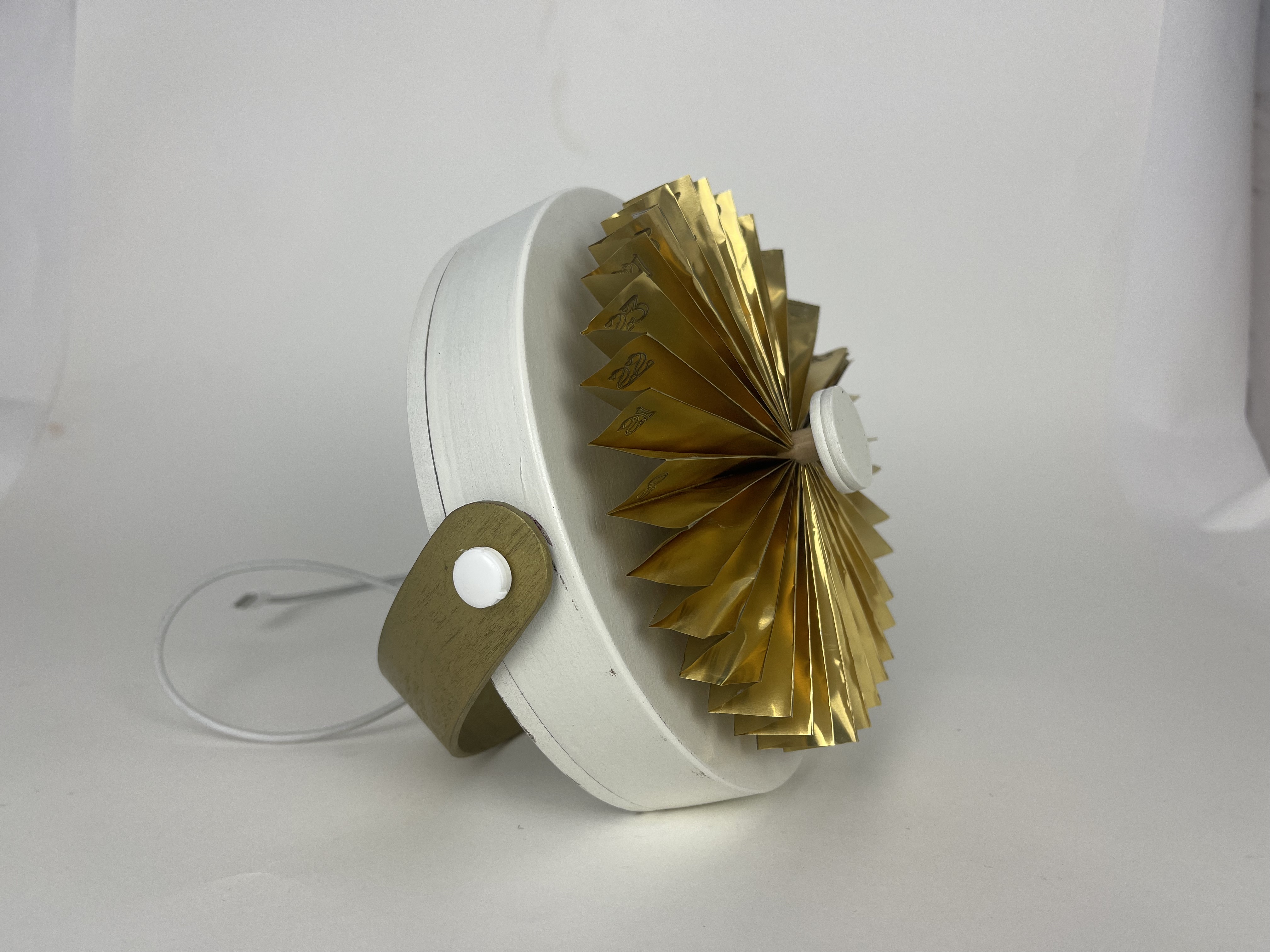 Final period. device in brass finish, photographed in studio