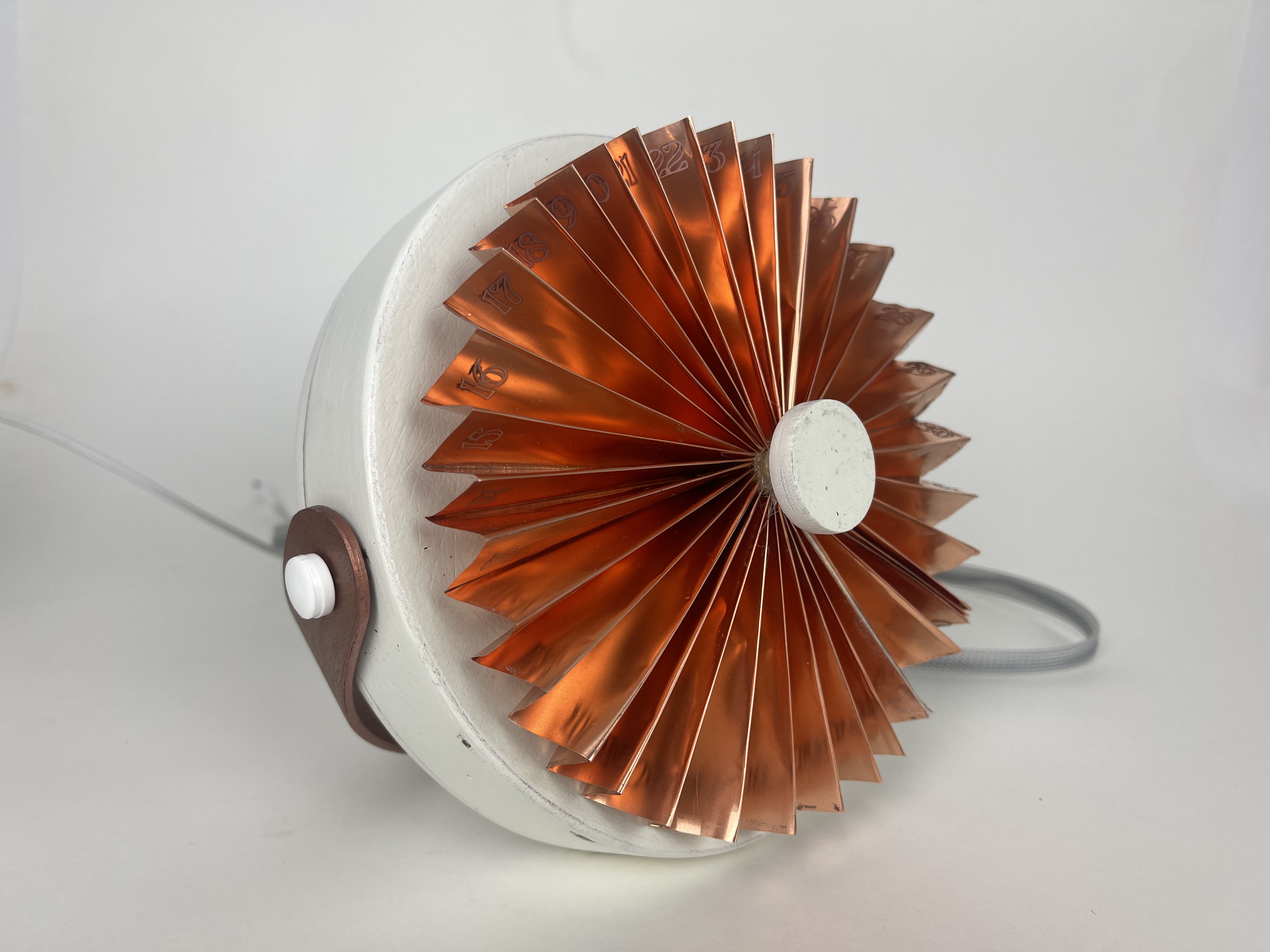 Final period. device in copper finish, photographed in studio