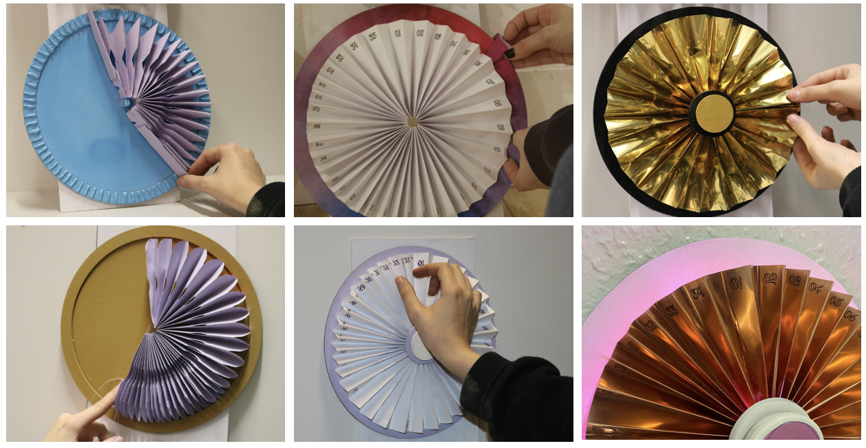 Purple paper and gold foil accordion fan prototypes at scale