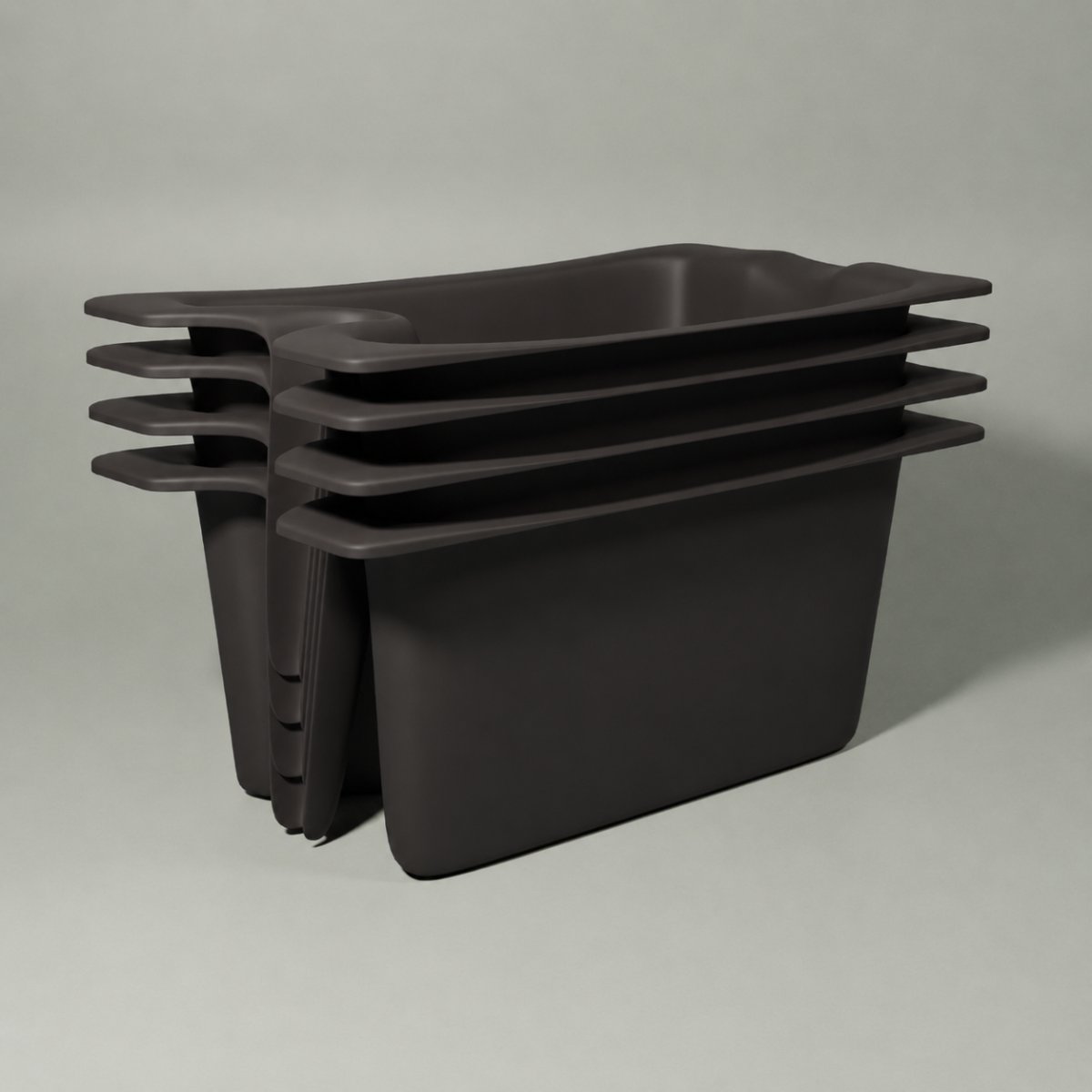 Four Vattenkanna units nested together in the dark colourway, shown stacked for flatpack shipping